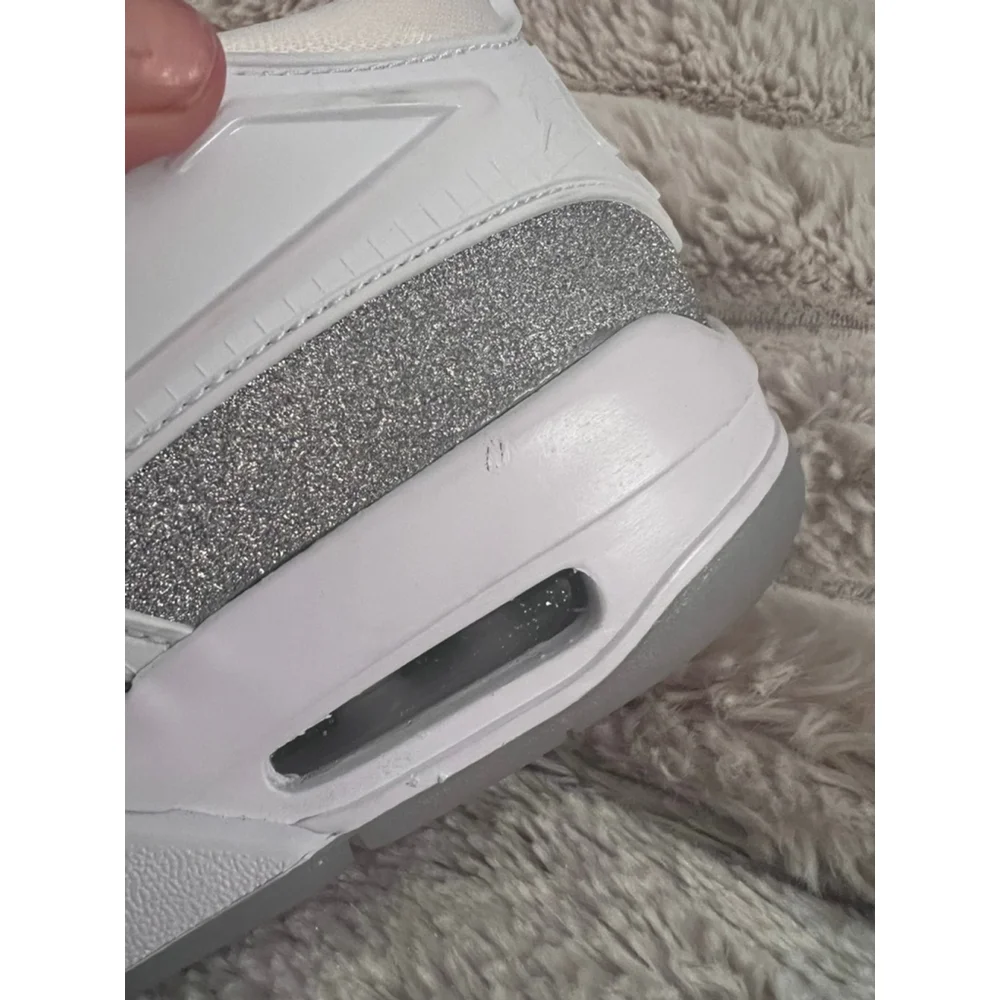 Air Jordan 4 RM 'White Silver Glitter' sneakers with the style code HQ34 size 7